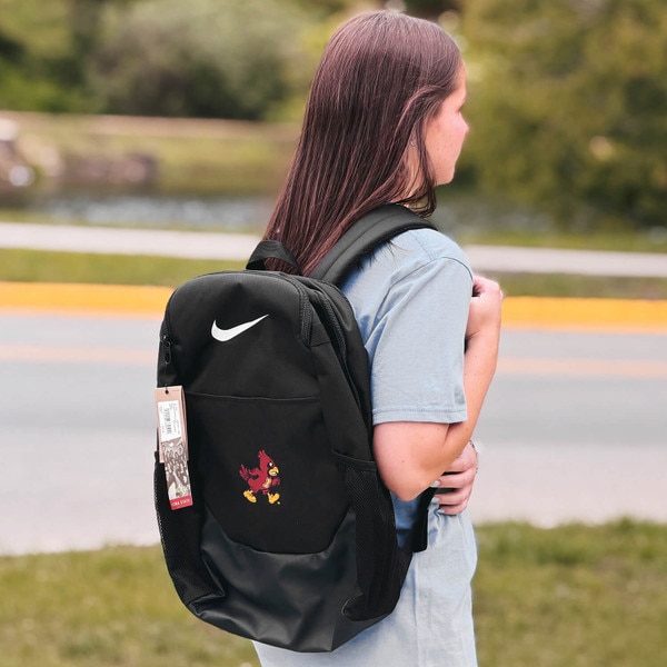 Student wearing Nike Walking Cy Brasilia Backpack